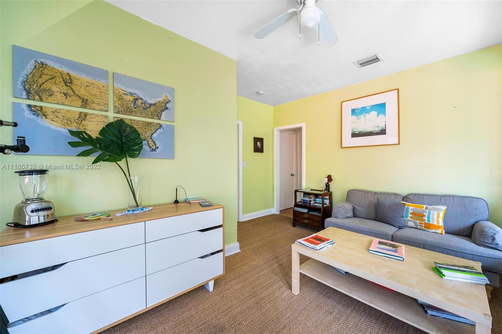 635 Northeast 68th Street Miami, FL 33138 - Photo 9 of 14 a living room with furniture and a flat screen tv