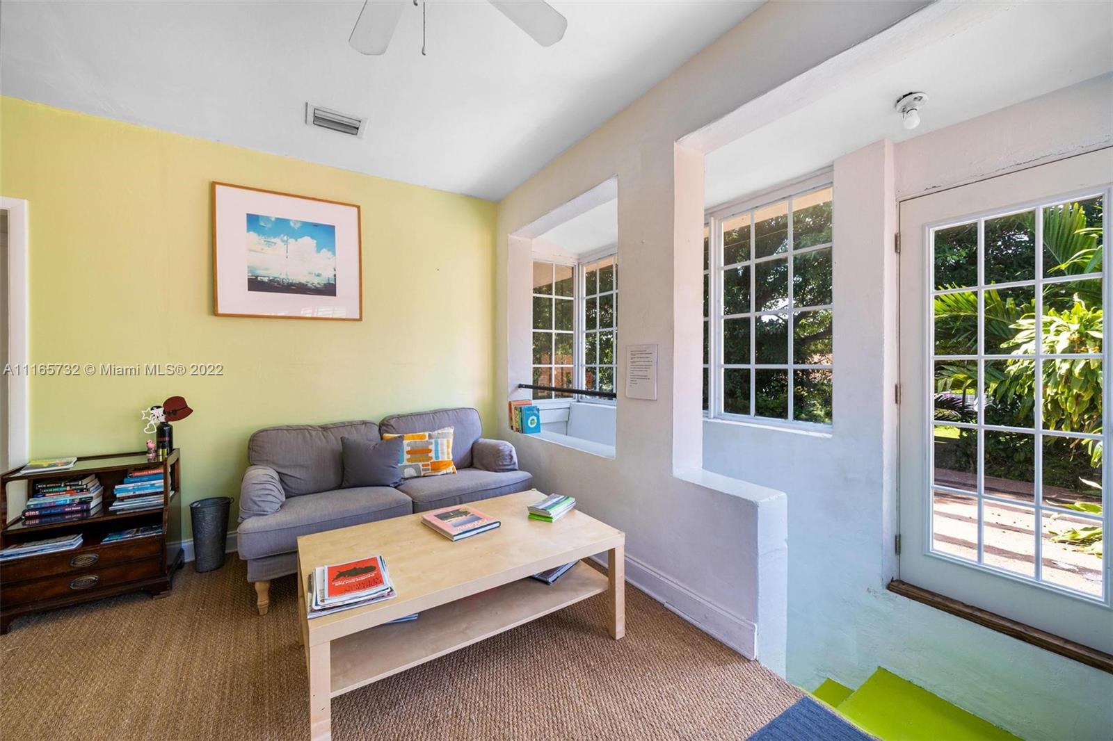 635 Northeast 68th Street Miami, FL 33138 - Photo 10 of 14 a living room with furniture and a window