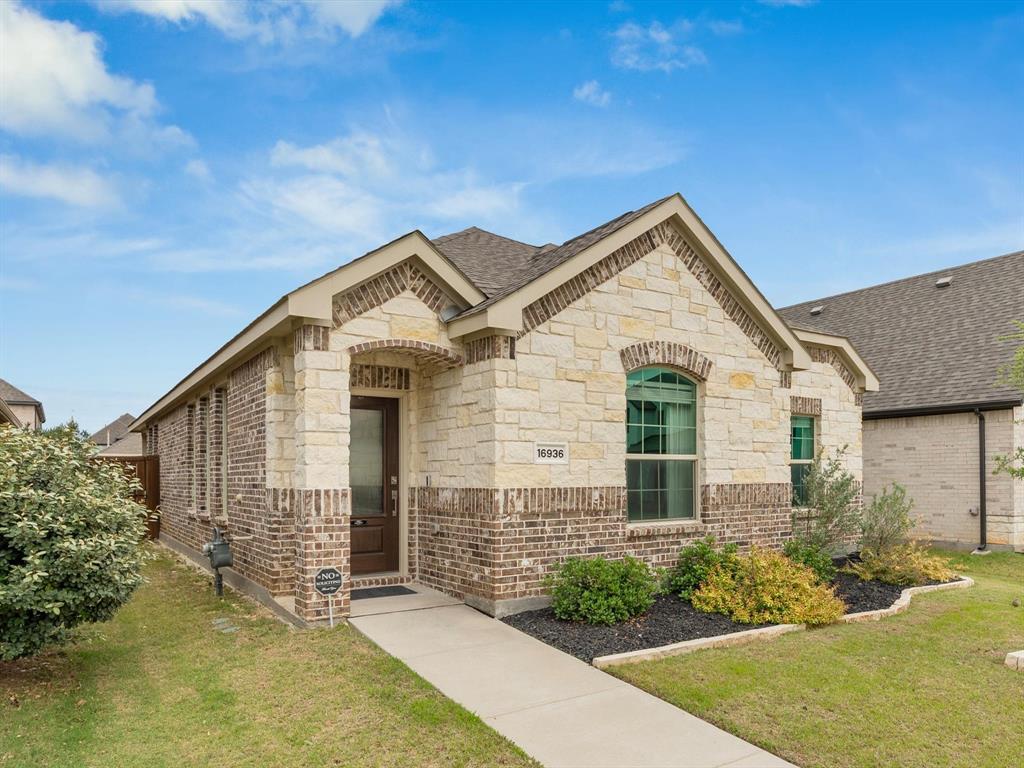 16936 Post Cedar Drive Justin, TX 76247 - Photo 27 of 30 Single-story residence featuring a combination brick and stone facade