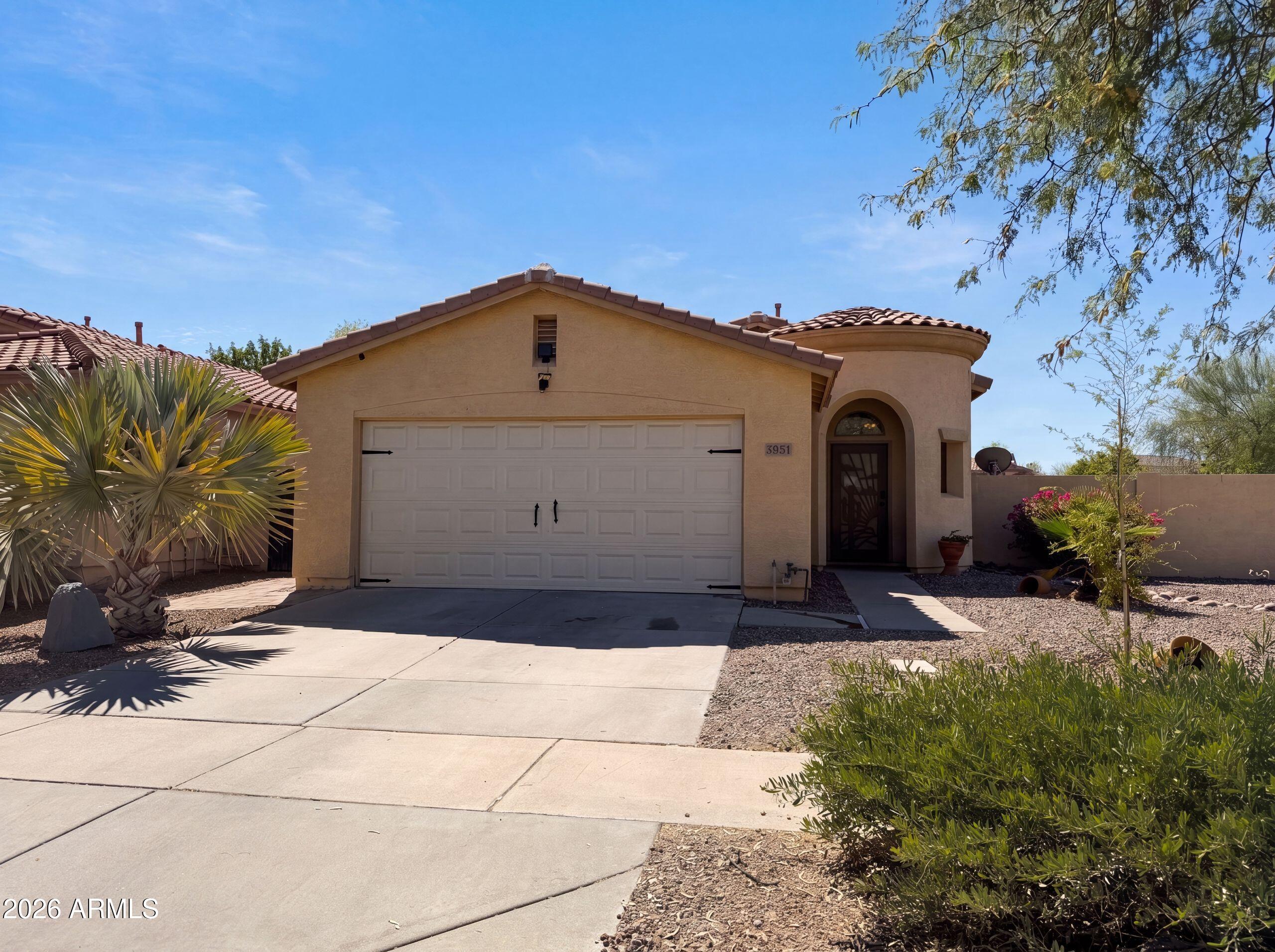 3951 East Timberline Road Gilbert, AZ 85297 - Photo 25 of 28 a front view of a house with a yard