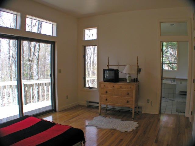 474 Norton Road Otis, MA 01029 - Photo 15 of 16 a bedroom with a bed and a window