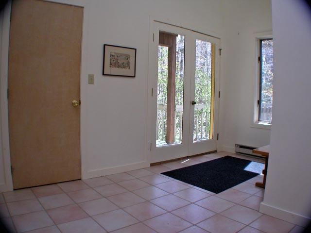 474 Norton Road Otis, MA 01029 - Photo 3 of 16 a room with a window and a painting on the wall
