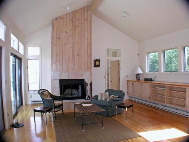 474 Norton Road Otis, MA 01029 - Photo 4 of 16 a living room with furniture and a fireplace