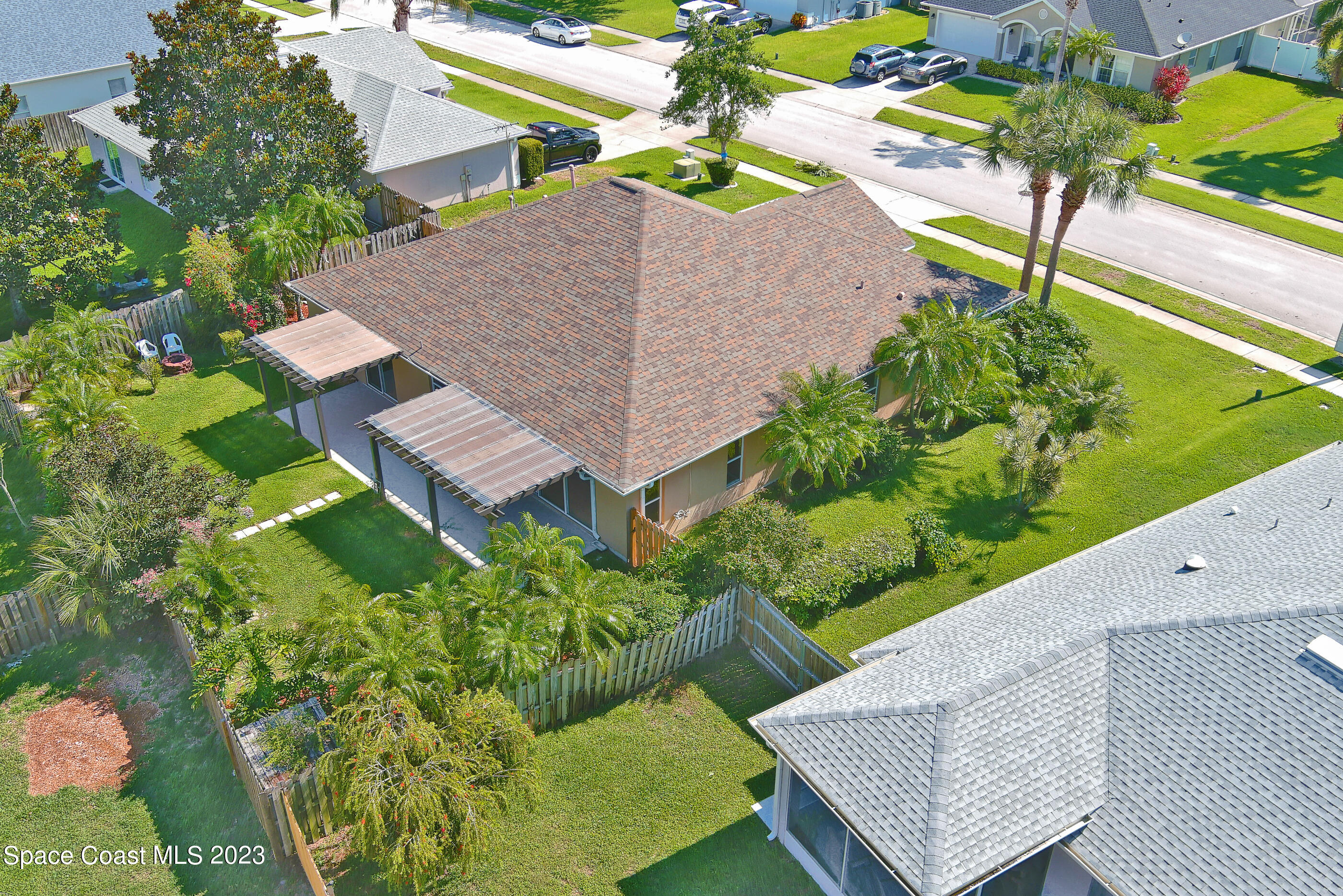 395 Brookcrest Circle Rockledge, FL 32955 - Photo 11 of 44 an aerial view of a house with garden space and street view