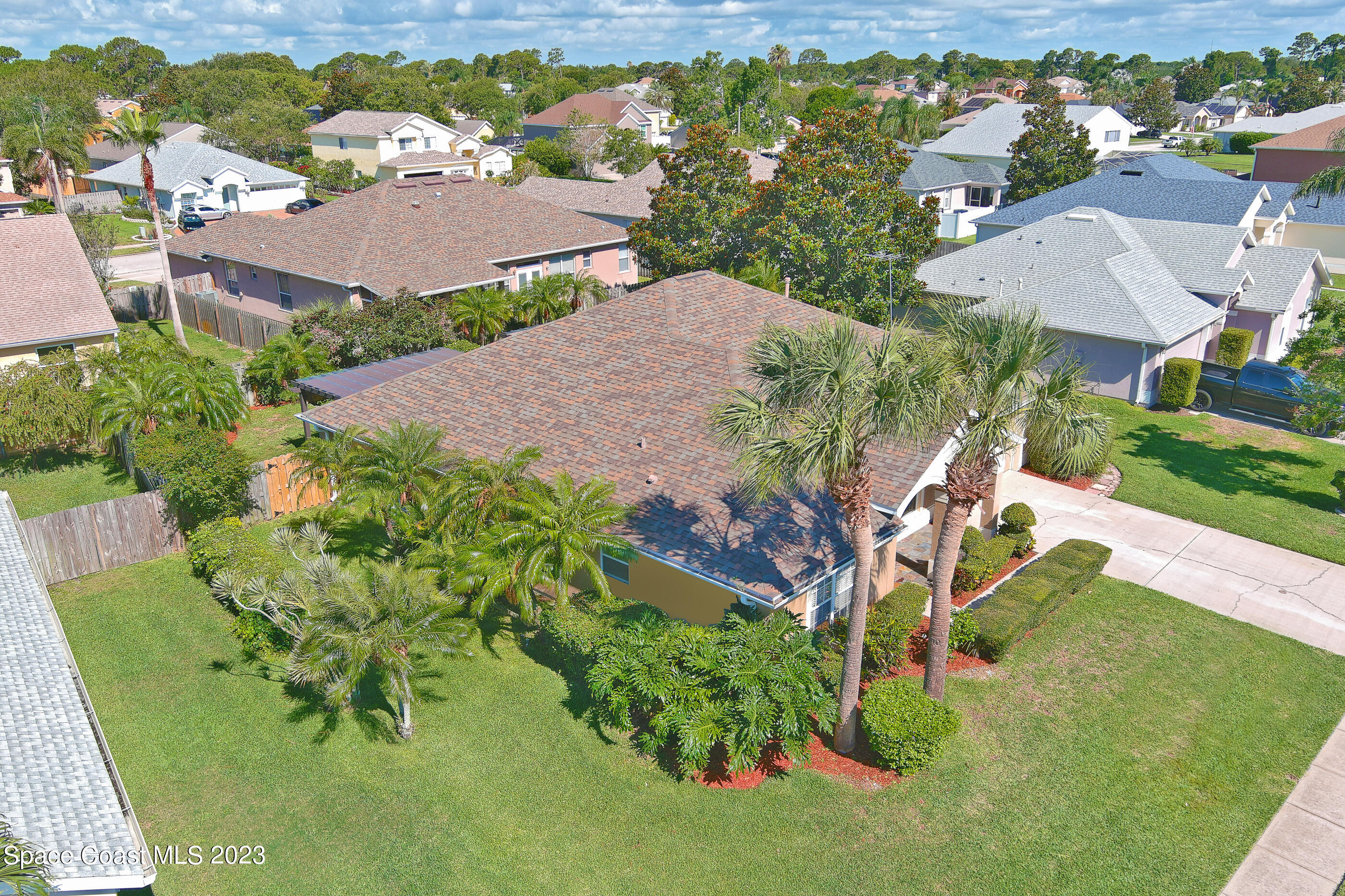 395 Brookcrest Circle Rockledge, FL 32955 - Photo 13 of 44 an aerial view of a house with a garden