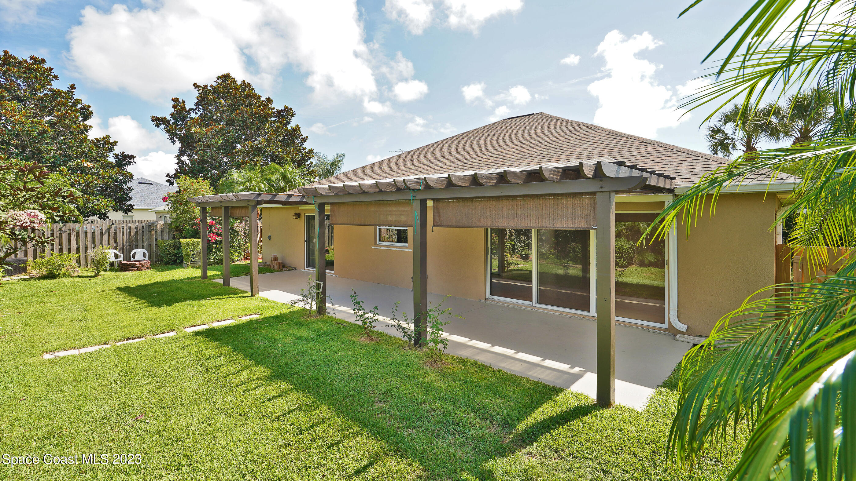 395 Brookcrest Circle Rockledge, FL 32955 - Photo 15 of 44 a front view of a house with garden