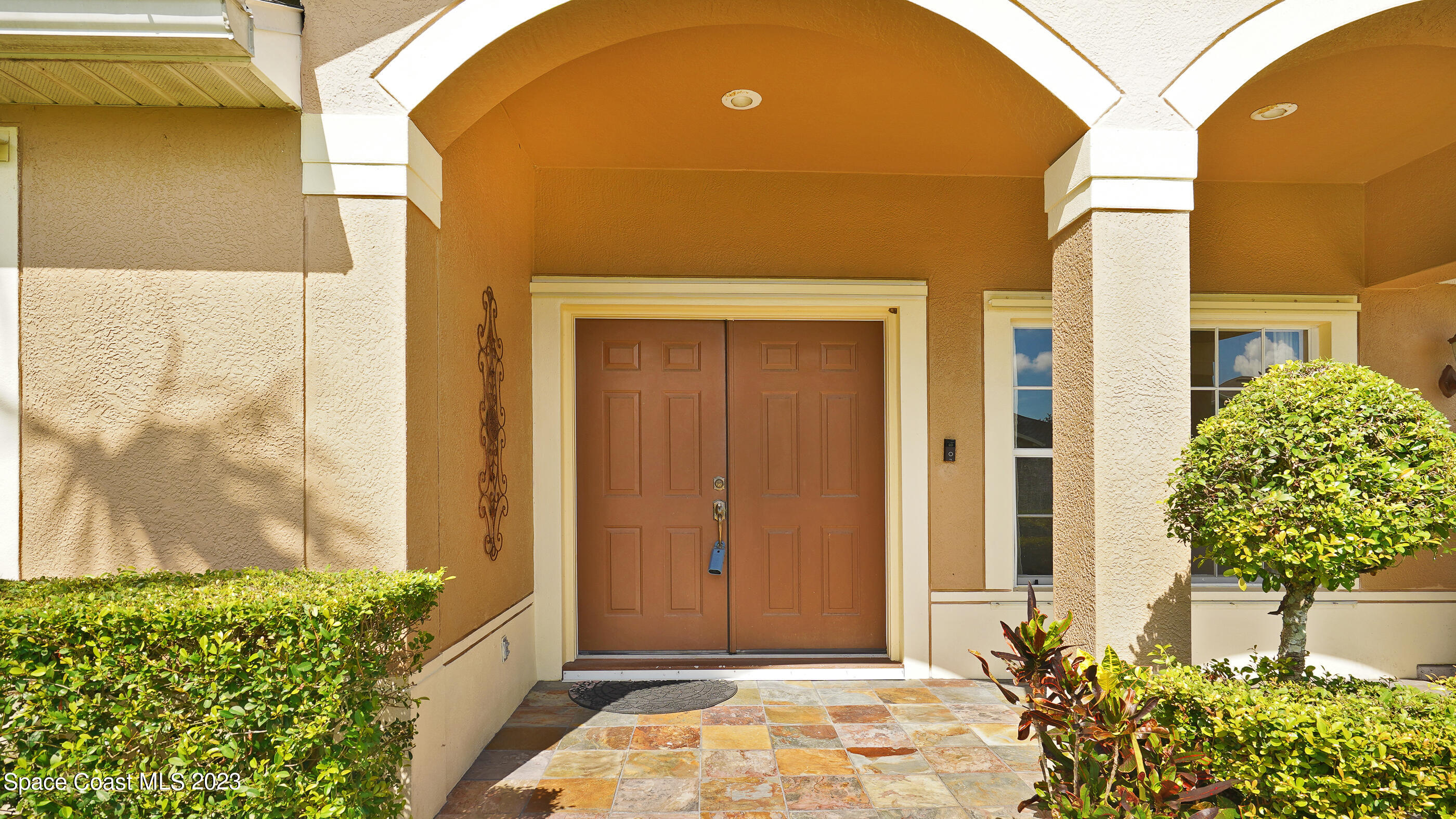395 Brookcrest Circle Rockledge, FL 32955 - Photo 20 of 44 a front view of a house with a garden