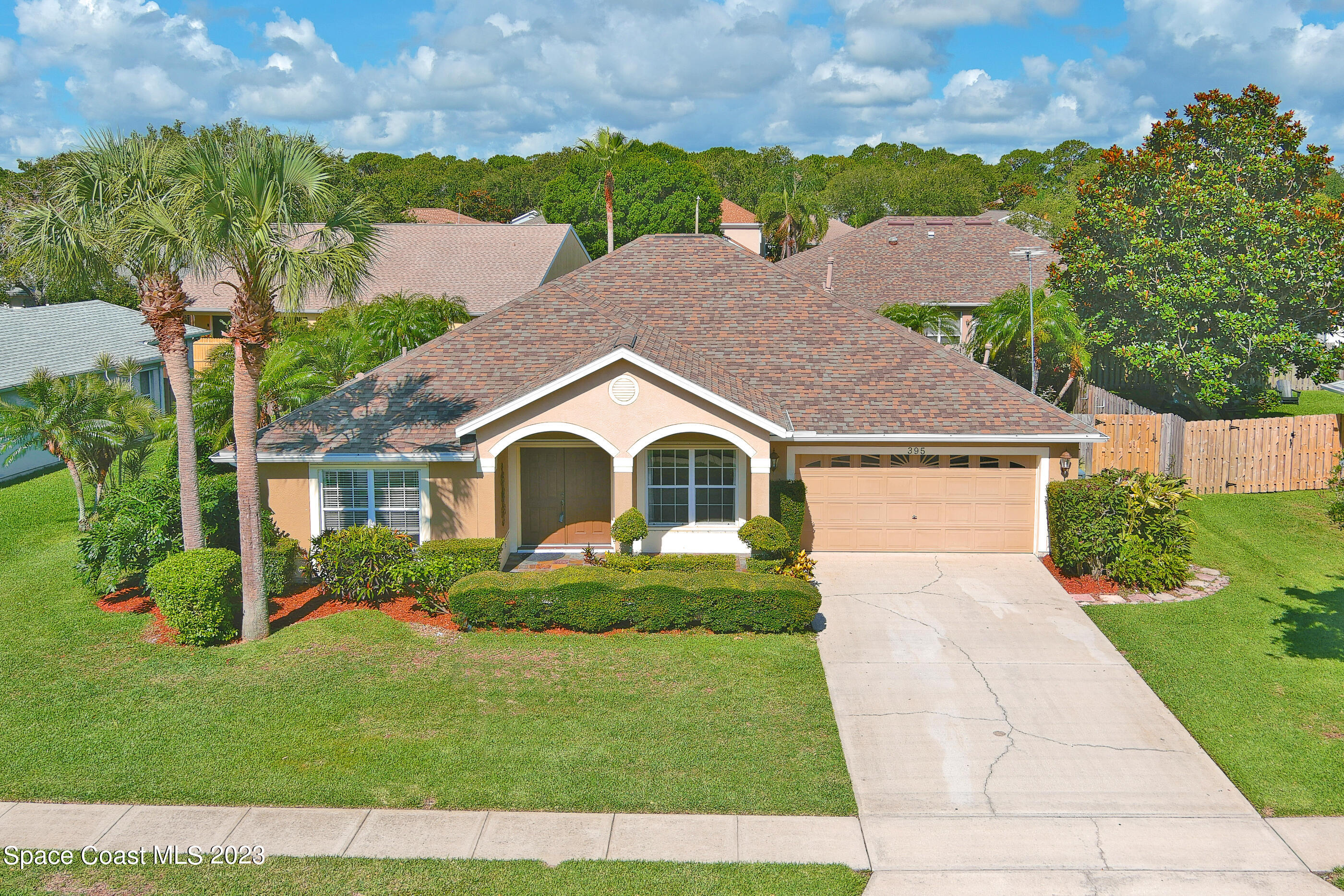 395 Brookcrest Circle Rockledge, FL 32955 - Photo 2 of 44 front view of a house with a yard