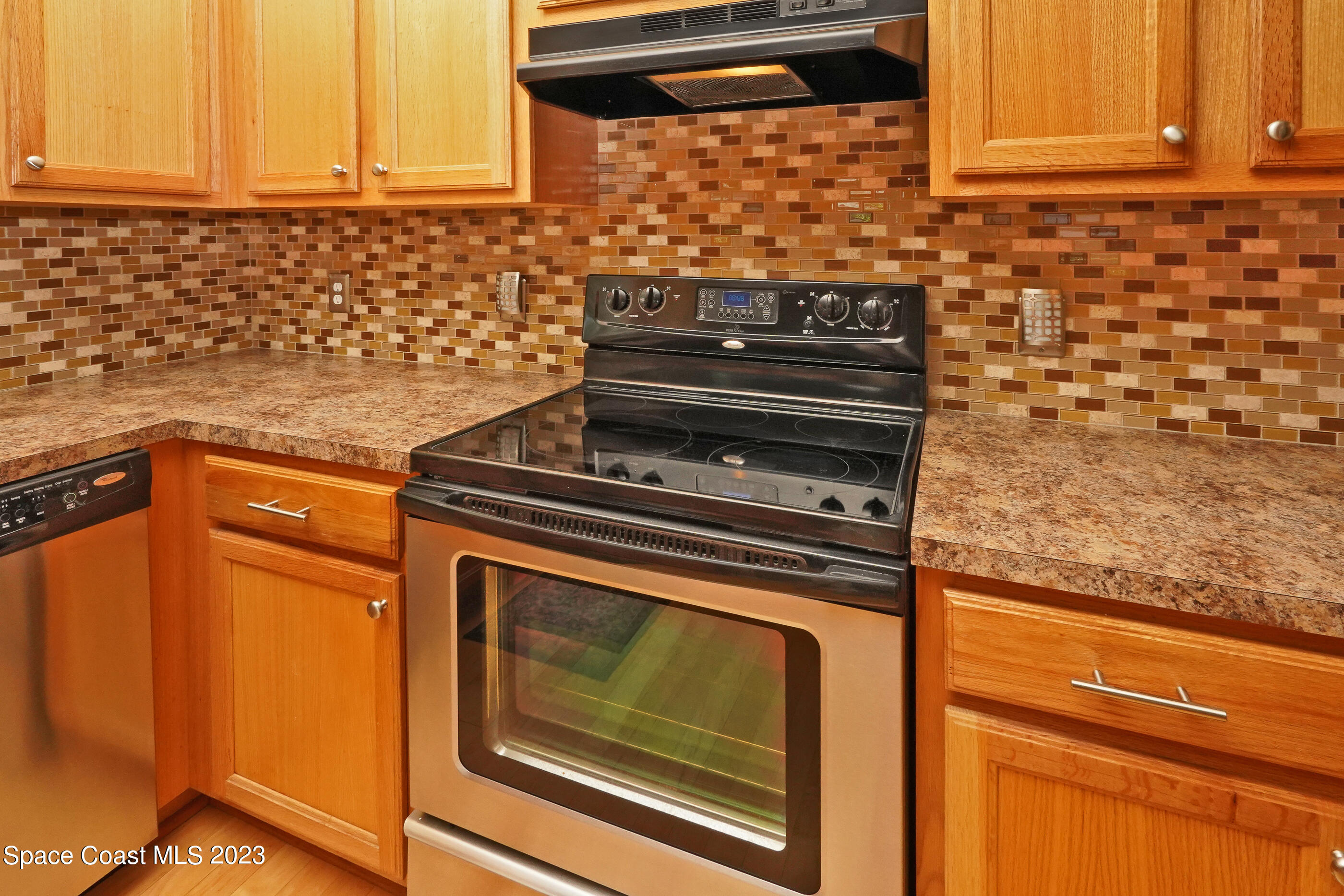 395 Brookcrest Circle Rockledge, FL 32955 - Photo 31 of 44 a stove top oven sitting inside of a kitchen