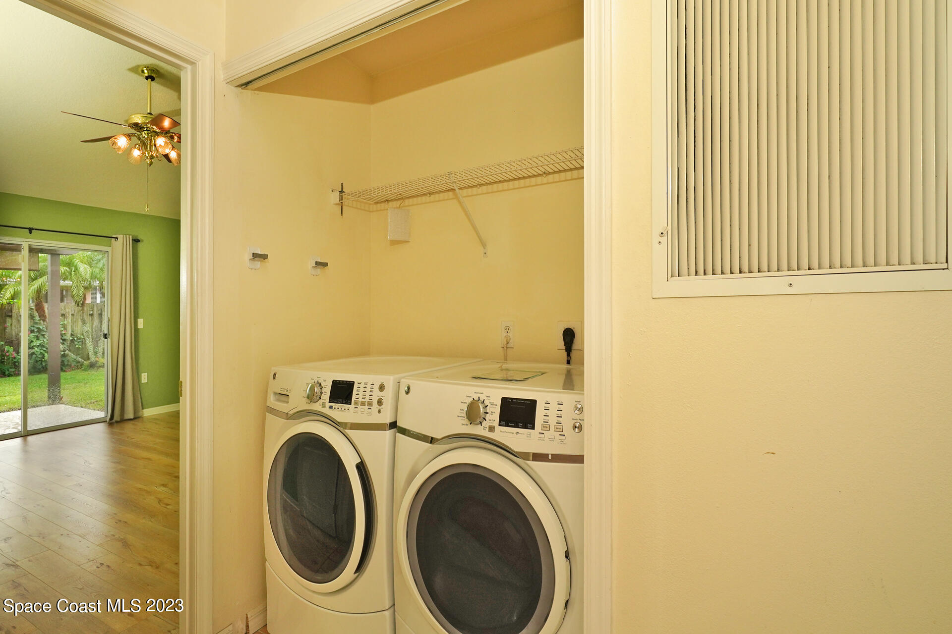 395 Brookcrest Circle Rockledge, FL 32955 - Photo 34 of 44 a view of a hallway with washer and dryer