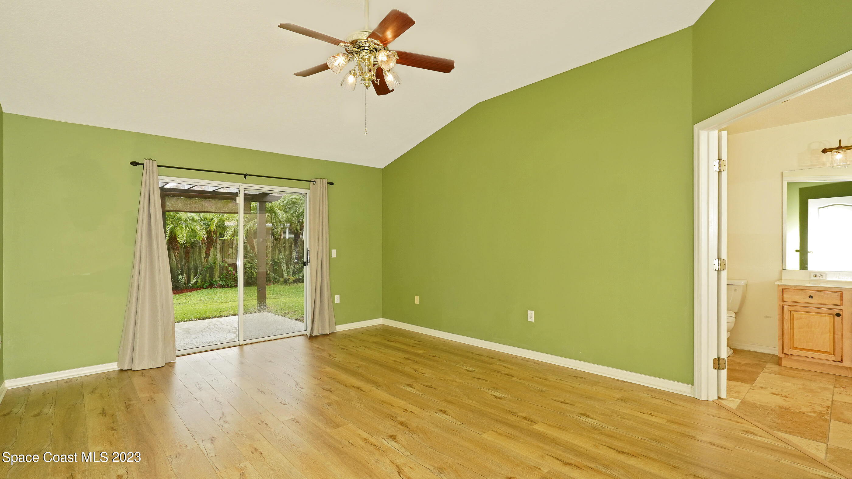 395 Brookcrest Circle Rockledge, FL 32955 - Photo 35 of 44 a view of a big room with wooden floor and windows