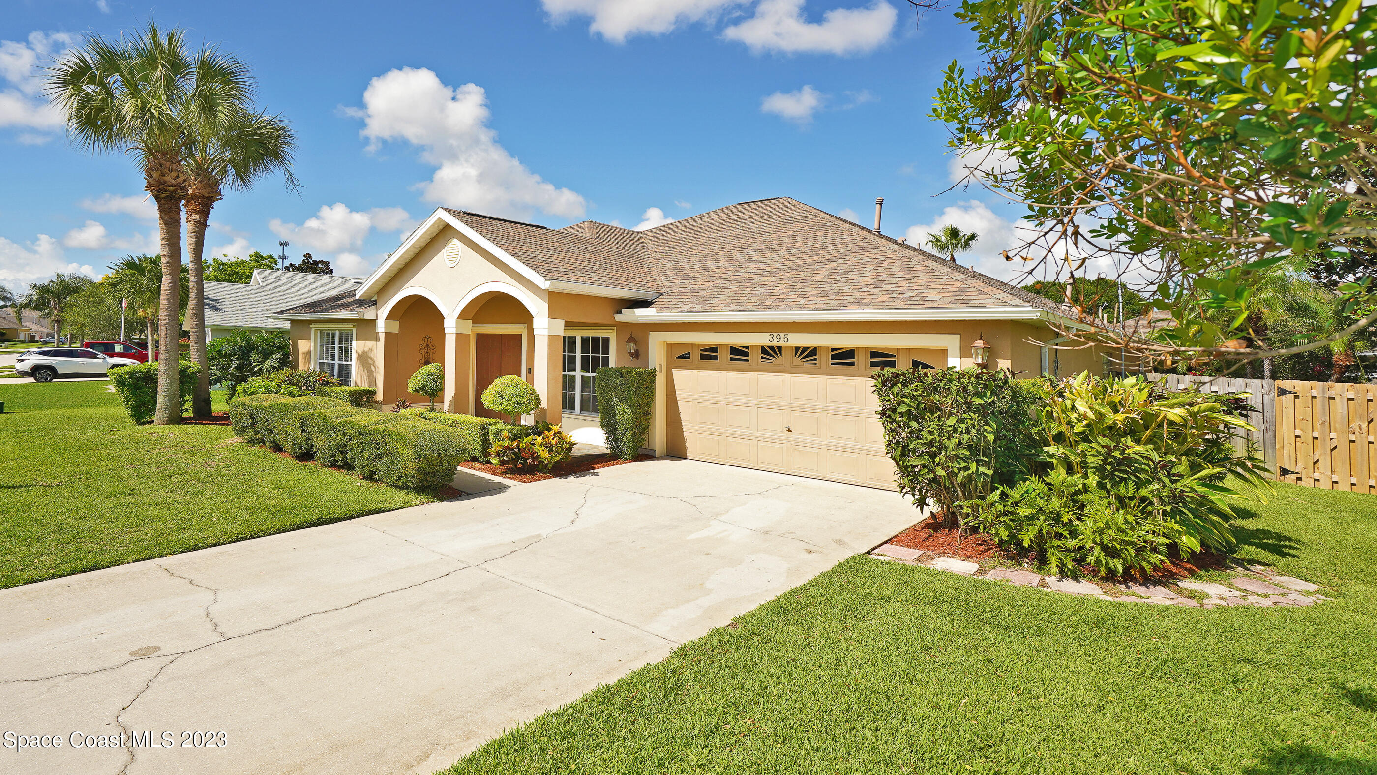 395 Brookcrest Circle Rockledge, FL 32955 - Photo 5 of 44 a front view of a house with garden