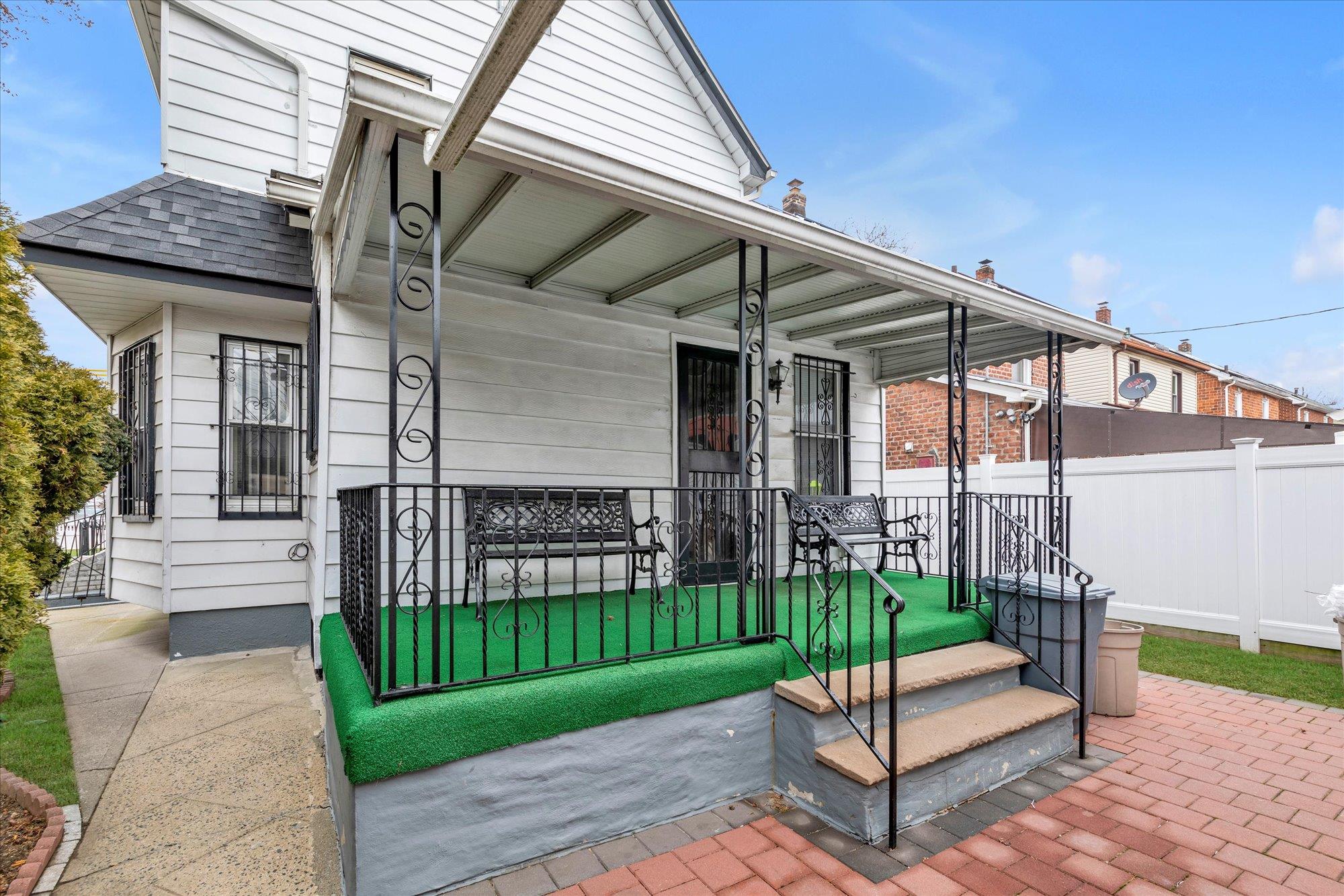113-07 Colfax Street Queens, NY 11429 - Photo 15 of 17 a view of a house with a backyard and porch