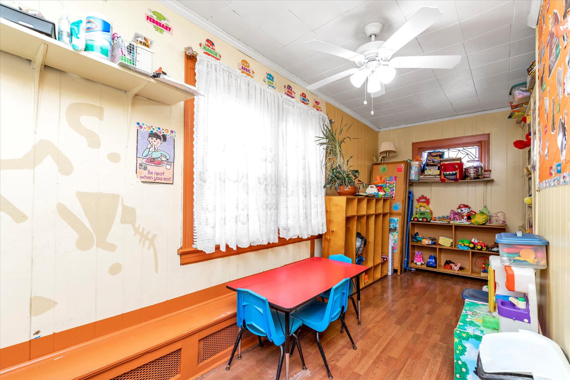 113-07 Colfax Street Queens, NY 11429 - Photo 8 of 17 a living room with furniture and a flat screen tv