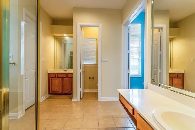 a spacious bathroom with a tub and shower