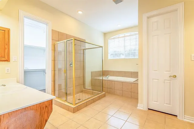 a living room with furniture a ceiling fan a flat screen tv and a window