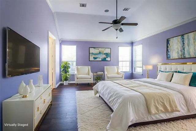 a large kitchen with a sink and stainless steel appliances