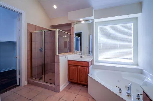 a bedroom with bed and a chandelier