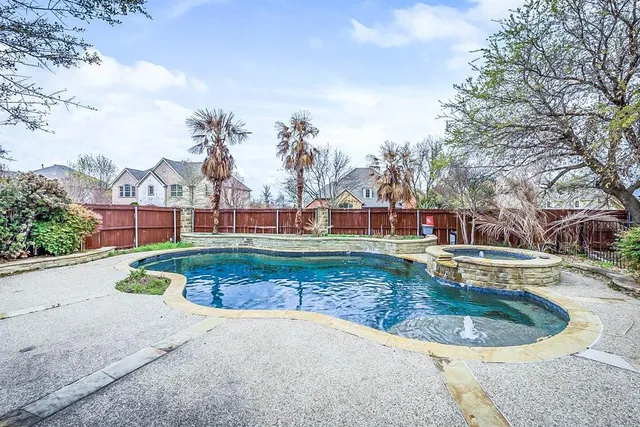 a view of a swimming pool with a patio