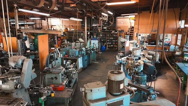 a kitchen with a refrigerator and a stove