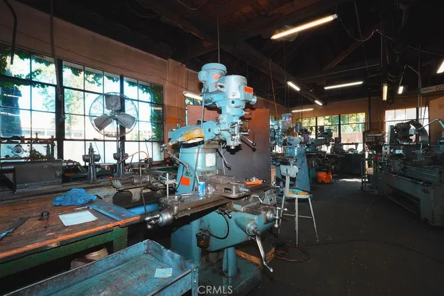 a room with lots of furniture and chandelier