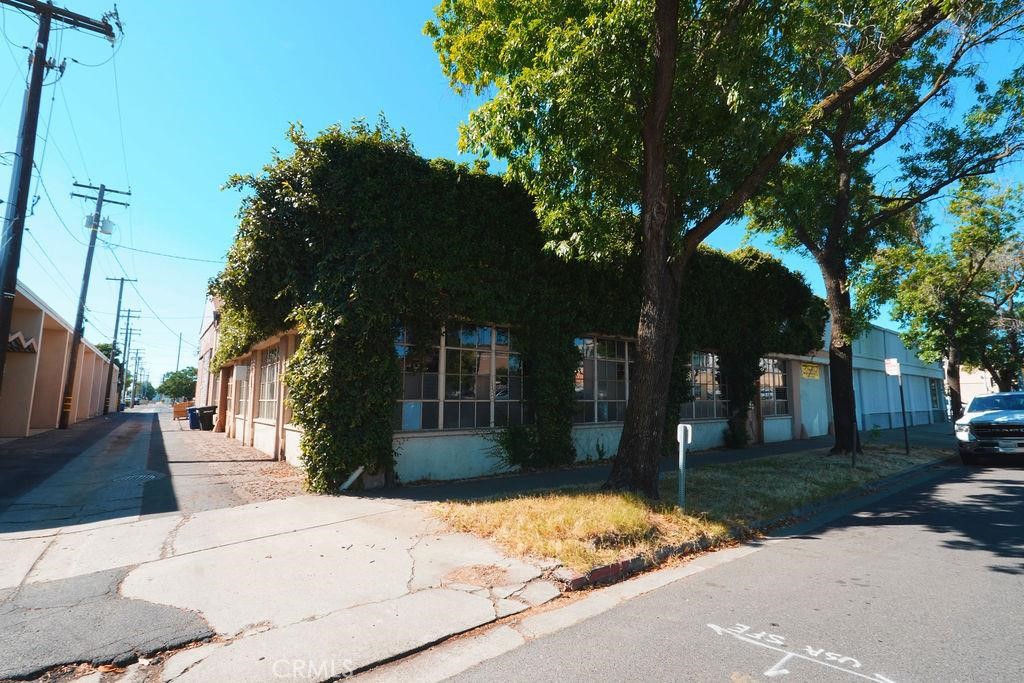 1106 G Street Modesto, CA 95354 - Photo 42 of 44 a front view of a house with a yard and tree s