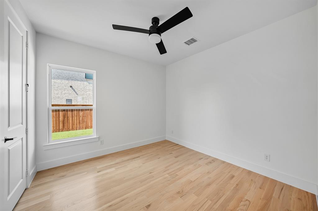587 Mayfair Lane Frisco, TX 75033 - Photo 15 of 37 an empty room with a window and a ceiling fan