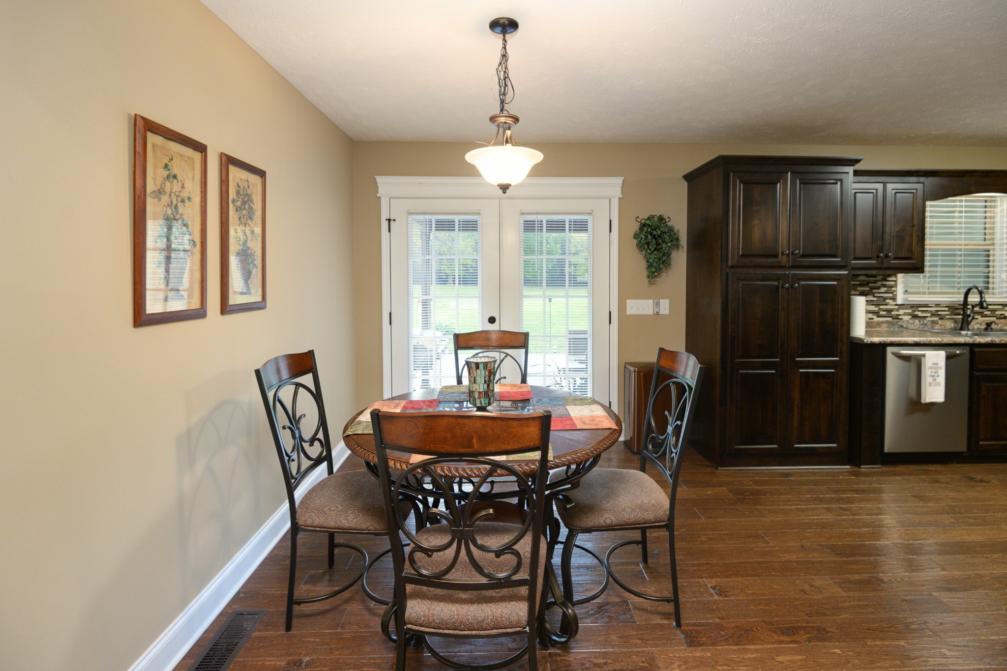 255 Troupe Road Shelbyville, TN 37160 - Photo 20 of 68 a dining room with furniture a chandelier and wooden floor