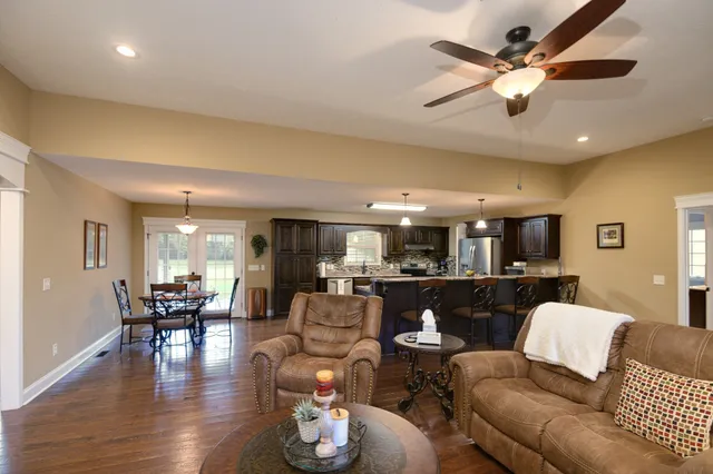 a bathroom with a sink and mirror with toilet