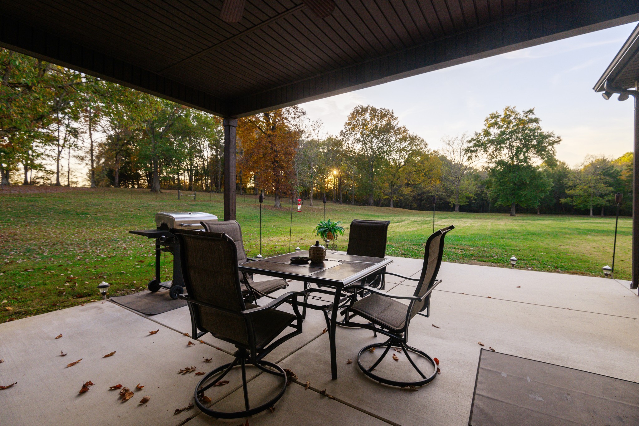255 Troupe Road Shelbyville, TN 37160 - Photo 40 of 68 a view of a patio with table and chairs next to an umbrella