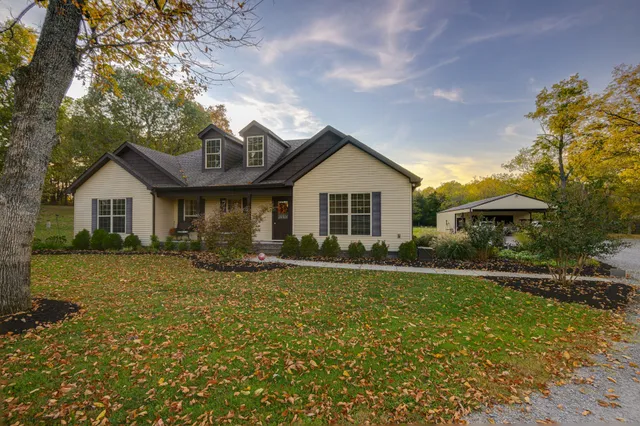 a front view of a house with a yard