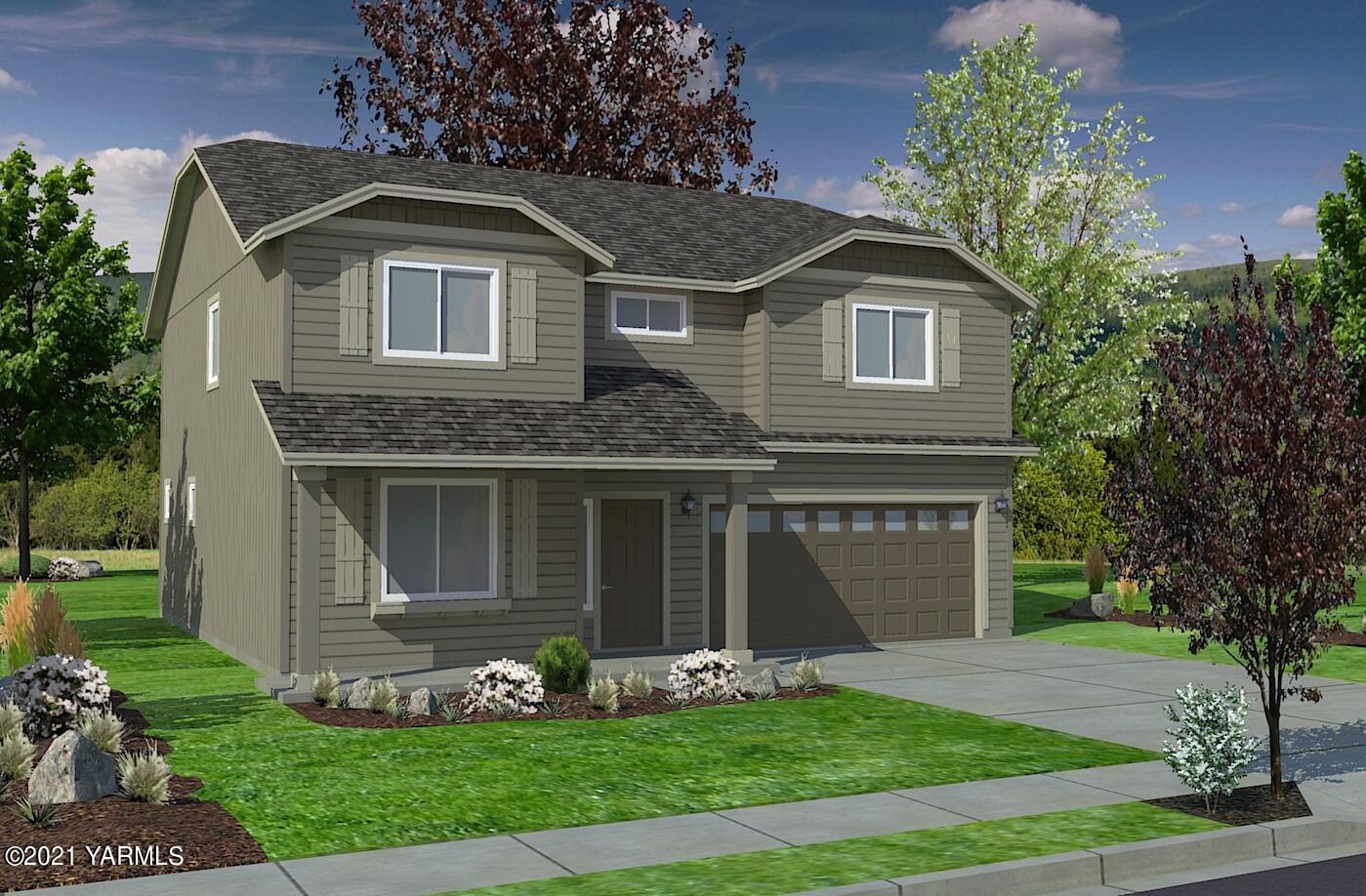 502 Stuart Street Moxee, WA 98936 - Photo 1 of 1 a front view of a house with garden