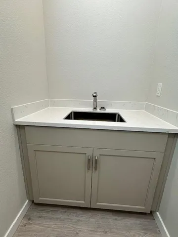 a close view of sink and cabinets