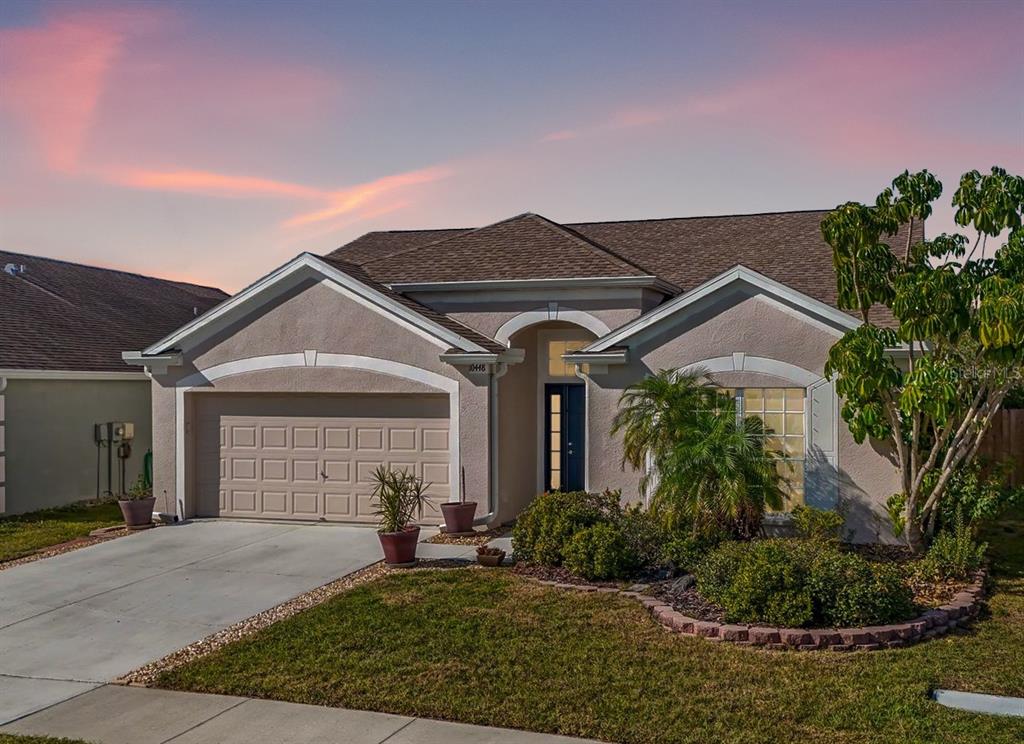 10448 Hallmark Boulevard Riverview, FL 33578 - Photo 1 of 1 a front view of a house with garden