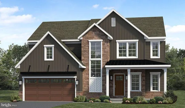 a front view of a house with yard