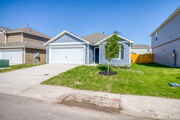 a view of front of house with a yard
