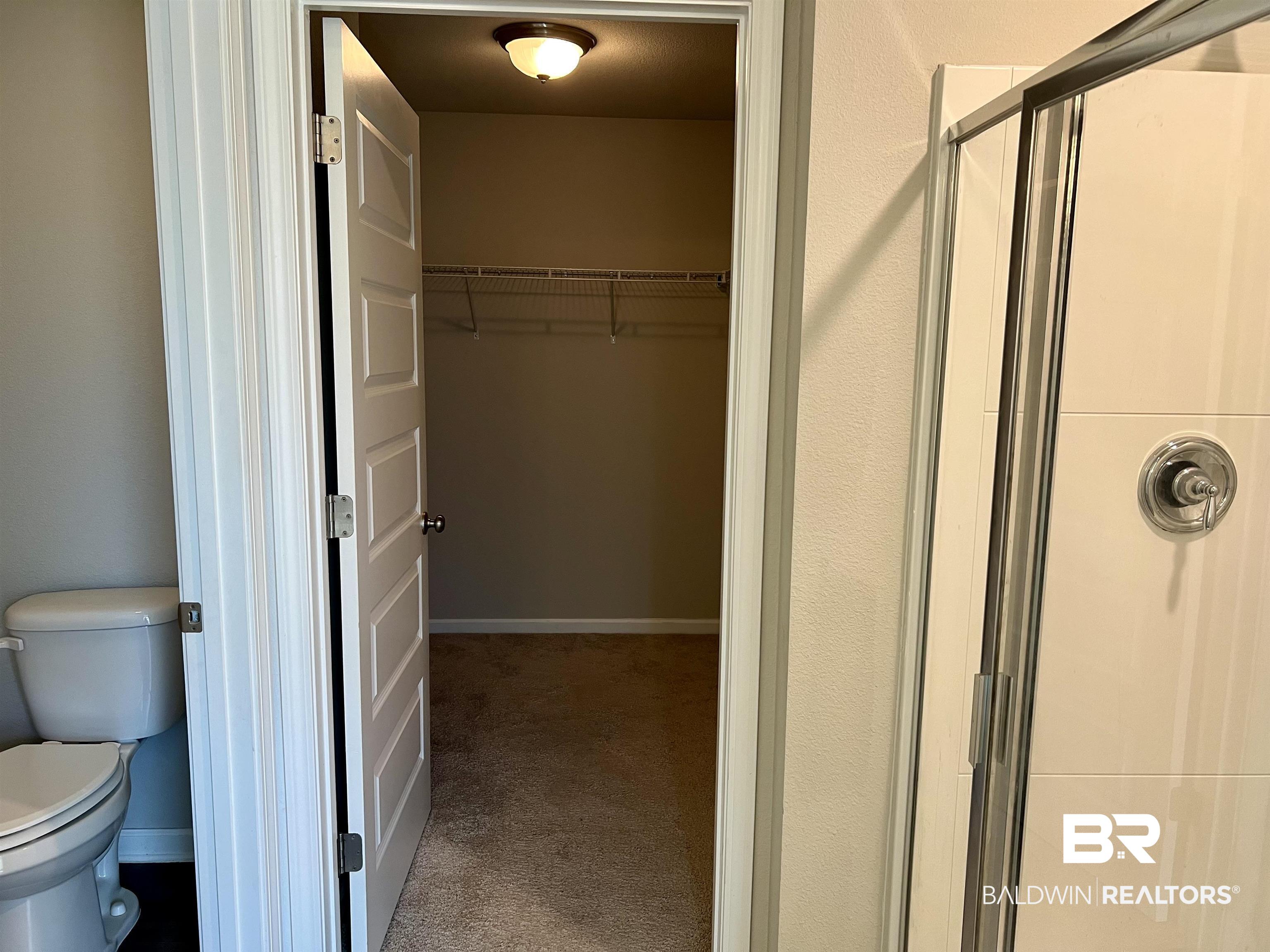 1612 Abbey Loop Foley, AL 36535 - Photo 22 of 30 Bathroom with walk in shower and toilet