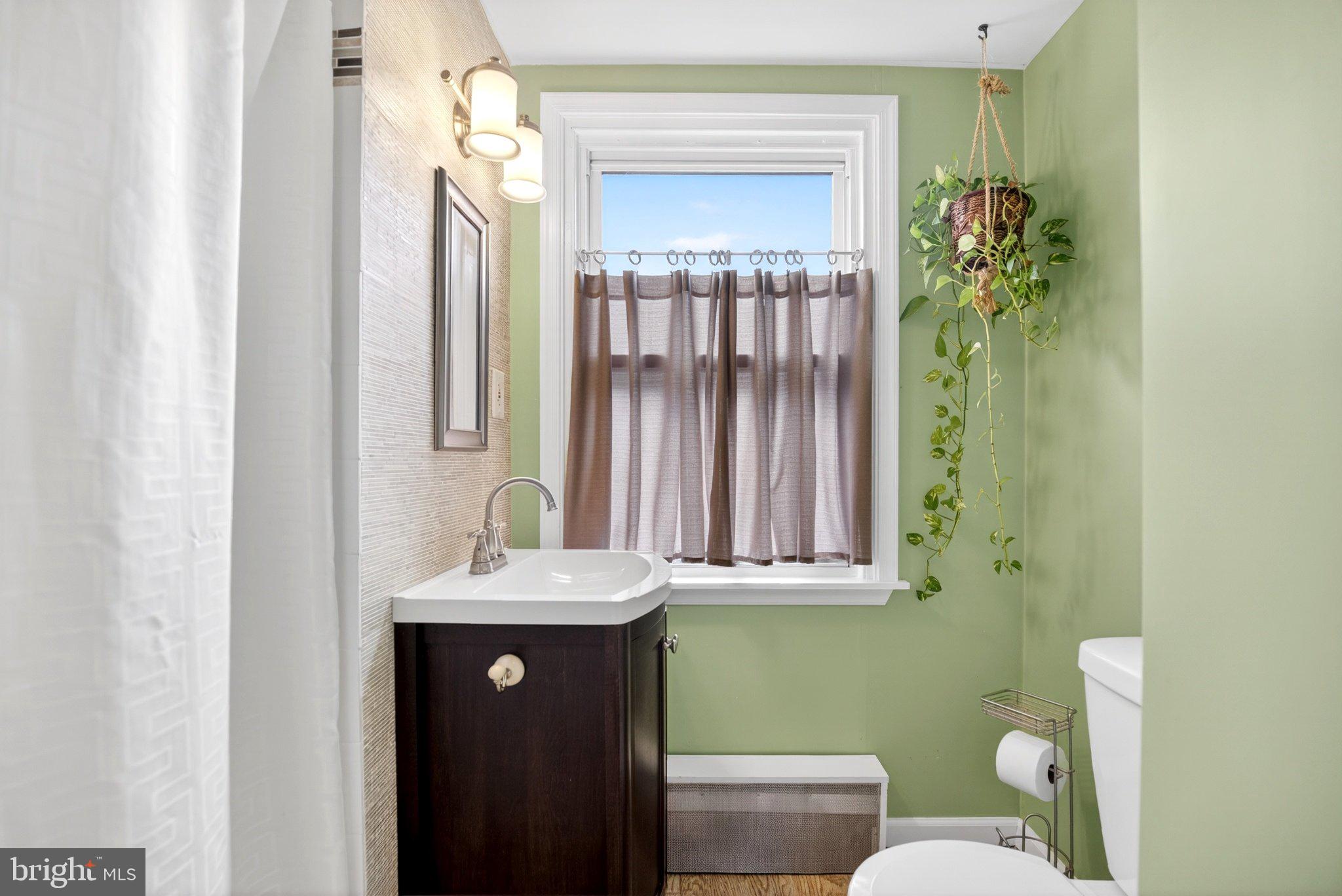 712 Clarendon Road Drexel Hill, PA 19026 - Photo 17 of 30 Charming bathroom with fresh greenery.