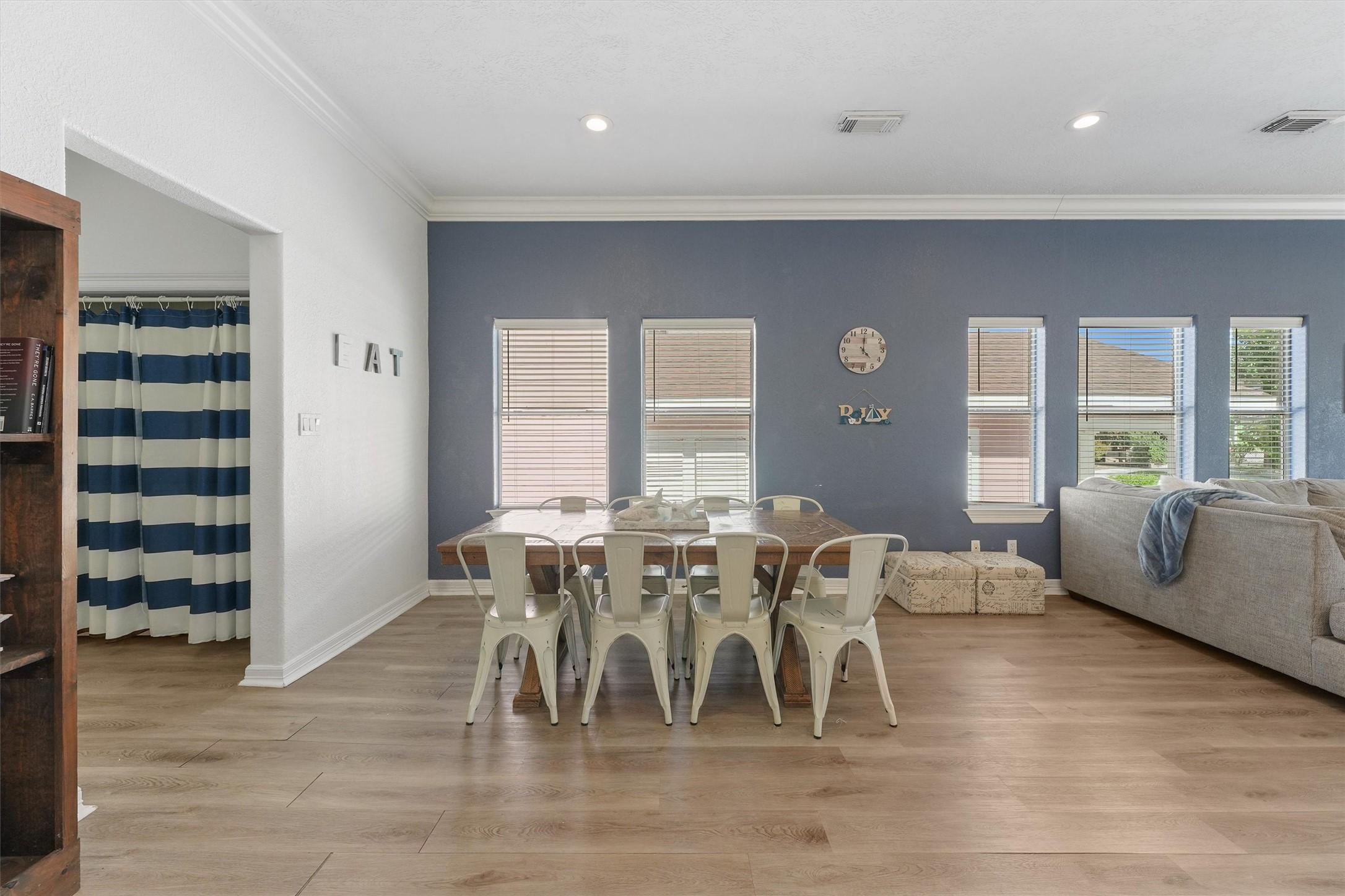 3024 Avenue R 1/2 Galveston, TX 77550 - Photo 12 of 28 a view of a dining room with furniture and wooden floor