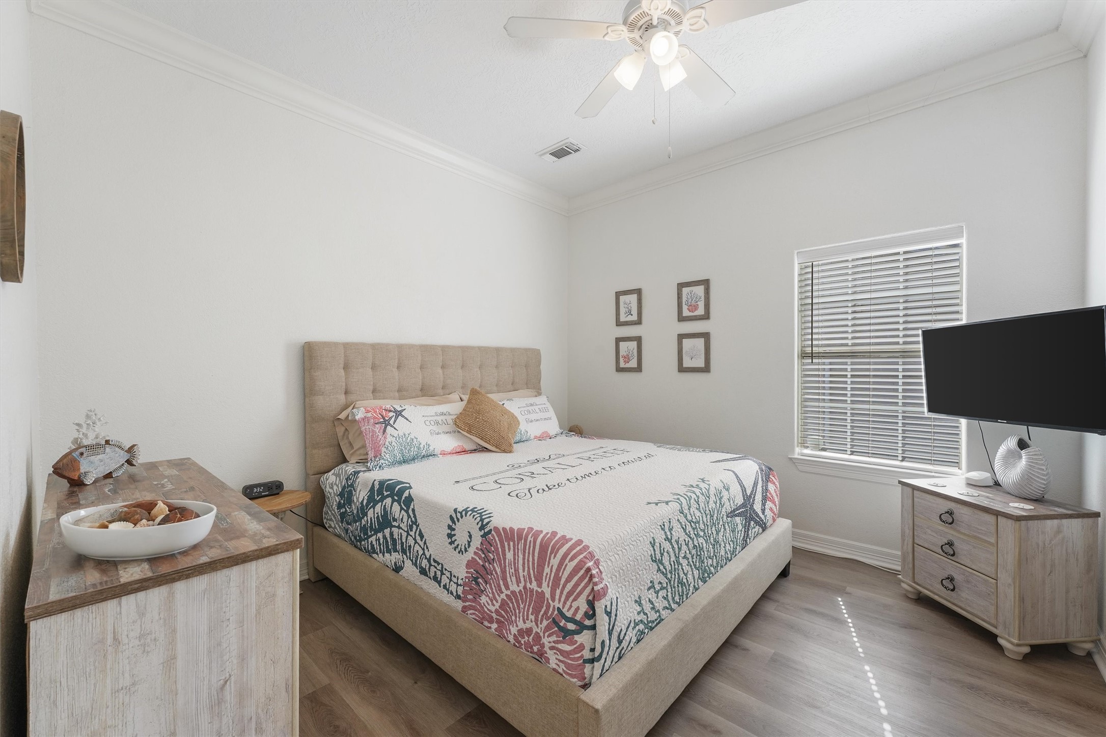 3024 Avenue R 1/2 Galveston, TX 77550 - Photo 19 of 28 a bedroom with a bed and a tv