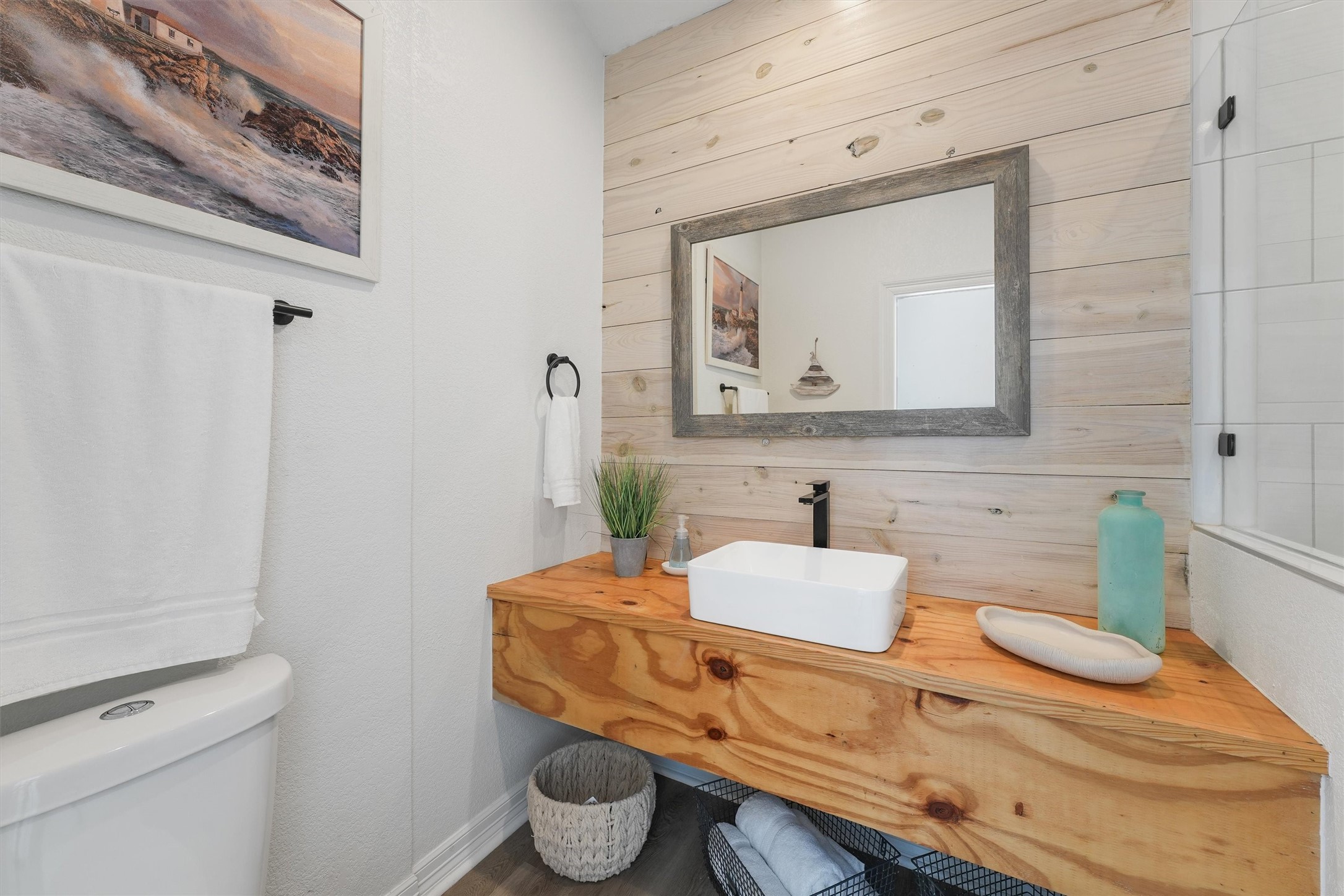 3024 Avenue R 1/2 Galveston, TX 77550 - Photo 20 of 28 a bathroom with a granite countertop toilet sink and mirror
