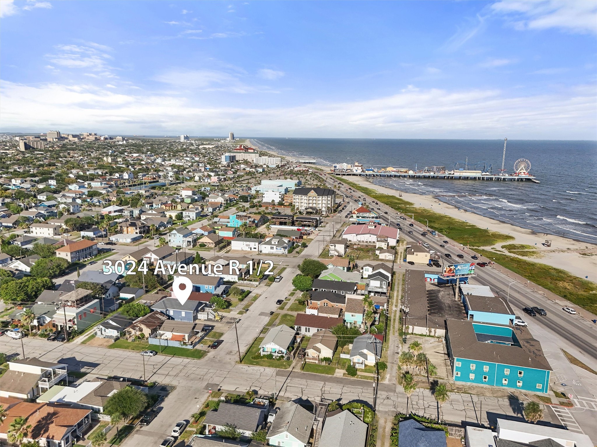 3024 Avenue R 1/2 Galveston, TX 77550 - Photo 2 of 28 an aerial view of a city