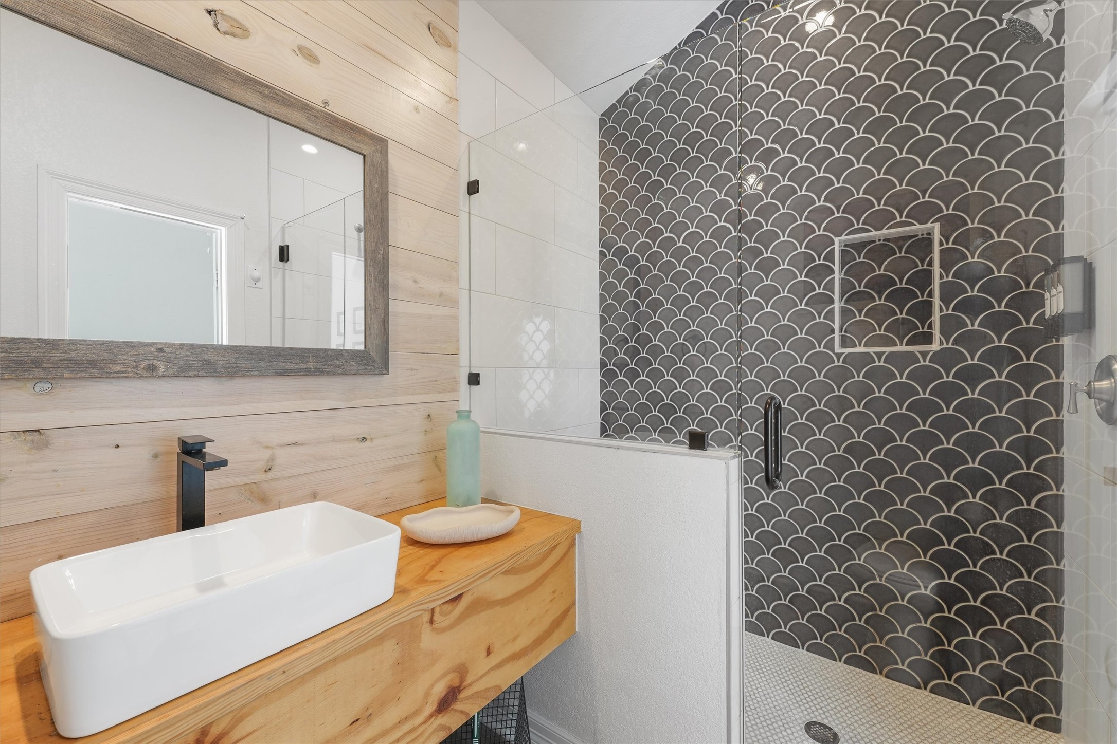 3024 Avenue R 1/2 Galveston, TX 77550 - Photo 21 of 28 a bathroom with a sink a toilet and mirror