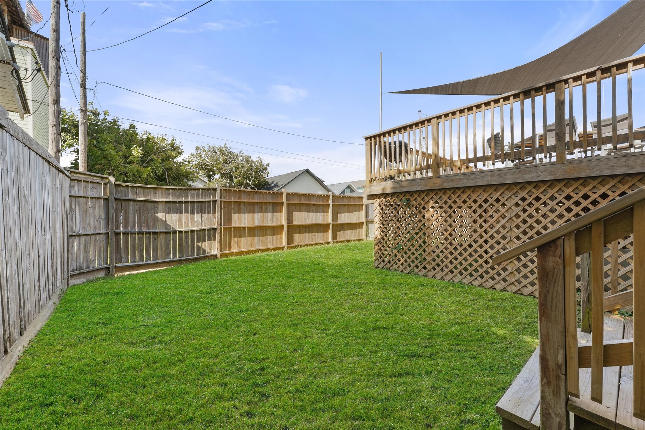 3024 Avenue R 1/2 Galveston, TX 77550 - Photo 24 of 28 a view of a deck with a big yard