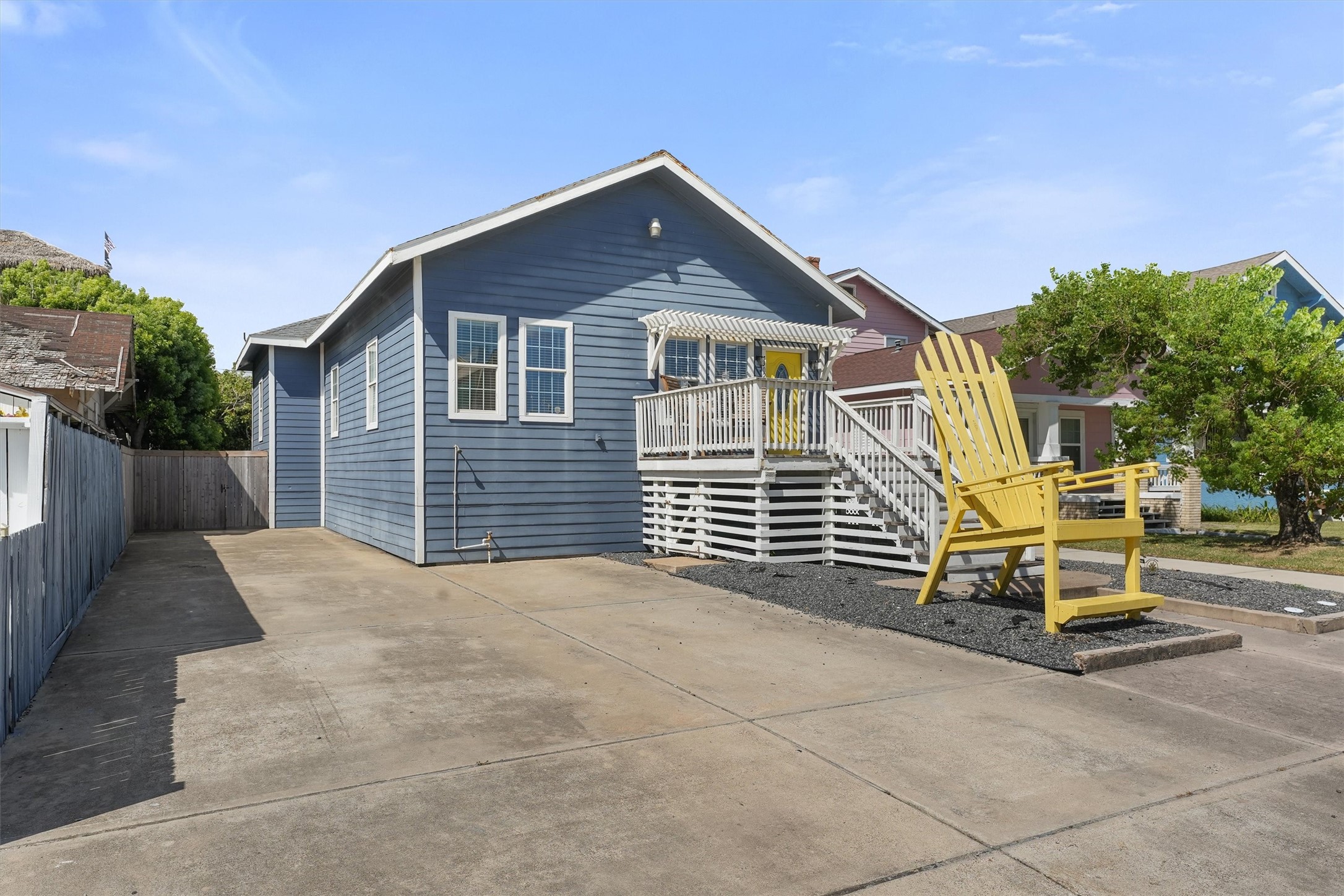 3024 Avenue R 1/2 Galveston, TX 77550 - Photo 7 of 28 a front view of a house with a yard