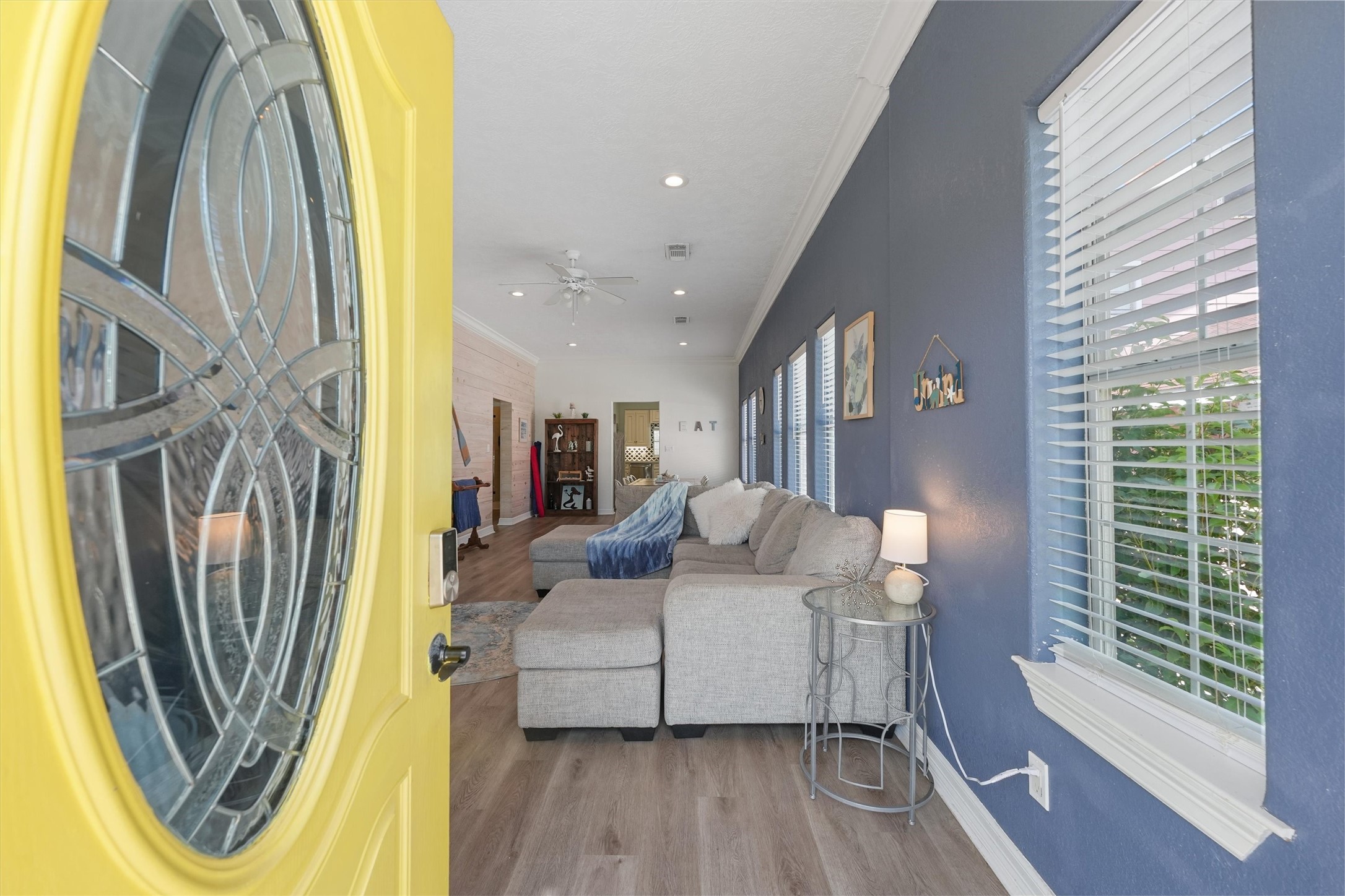 3024 Avenue R 1/2 Galveston, TX 77550 - Photo 8 of 28 a living room with a fireplace and a wooden floor
