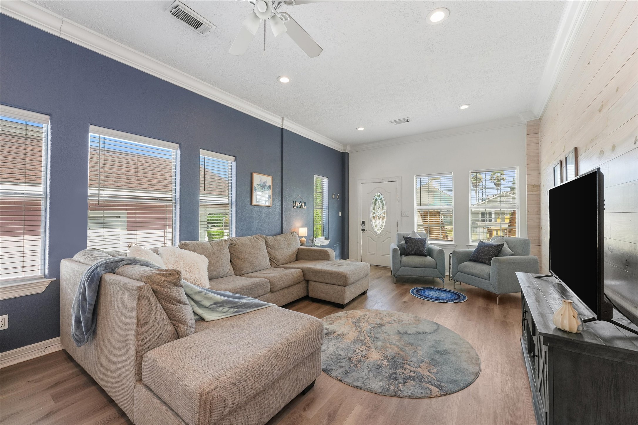 3024 Avenue R 1/2 Galveston, TX 77550 - Photo 9 of 28 a living room with furniture and a flat screen tv