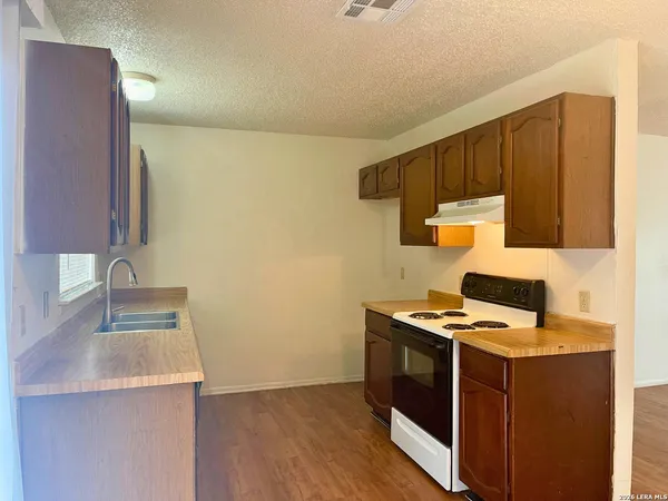a kitchen with a stove and a microwave