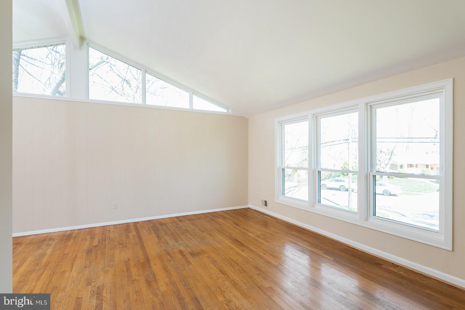 8940 Victoria Road Springfield, VA 22151 - Photo 9 of 29 Light and bright living room and hardwood floors.