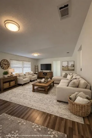a living room with furniture and a table